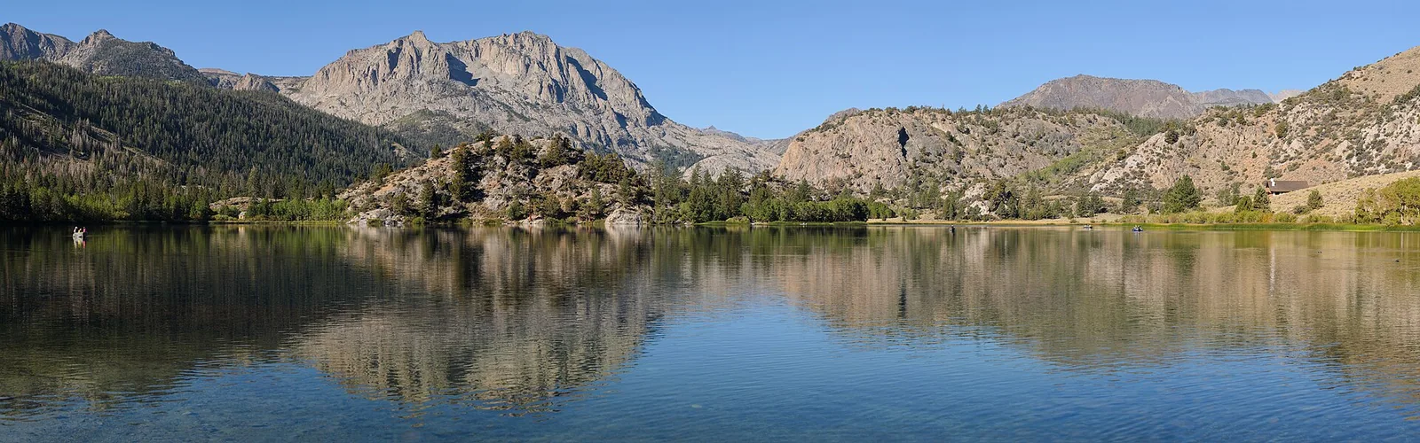 Gull Lake reflecting the surrounding Sierra Nevada mountains.